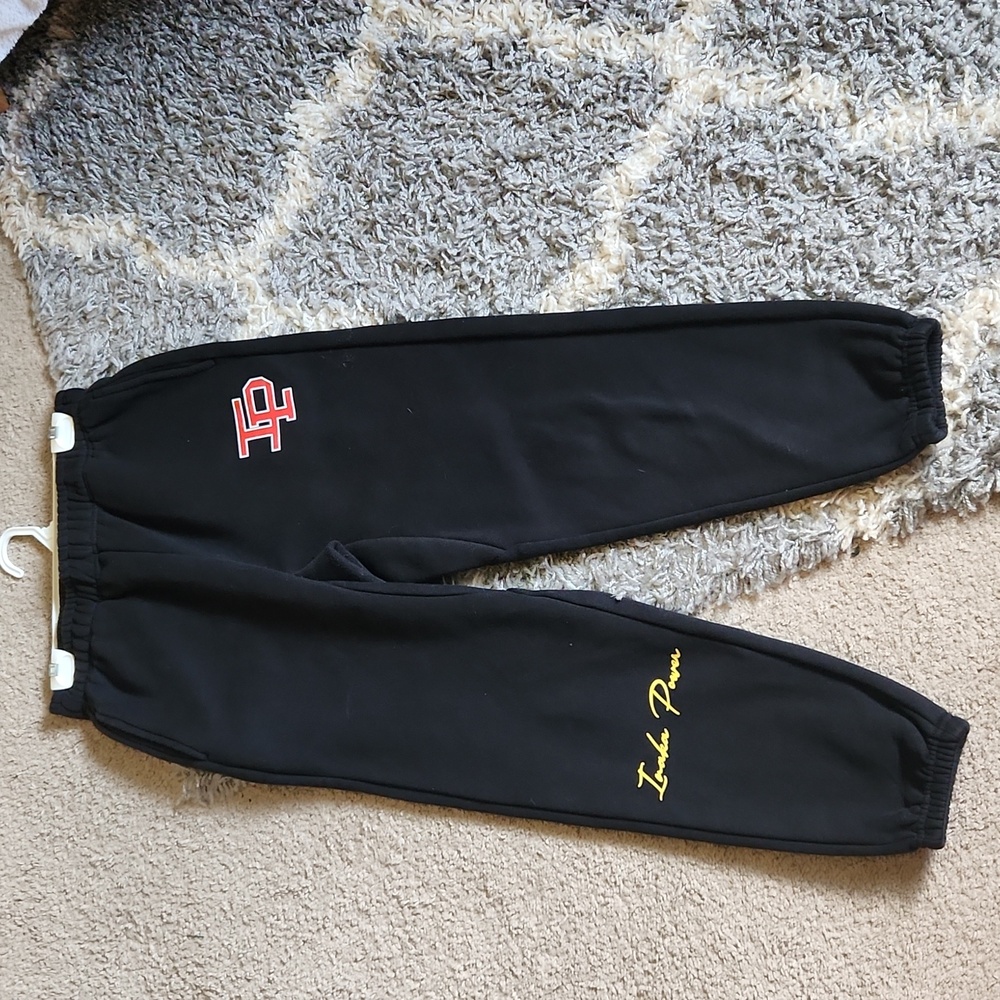 Inaka Power Black Track Pants with Red and Yellow Accents